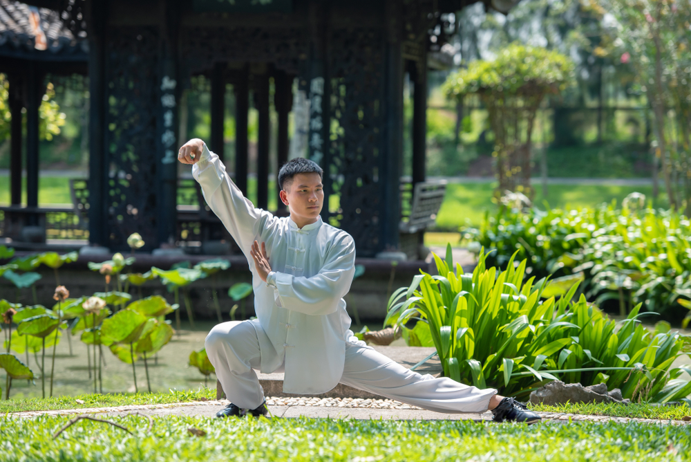 Asian,Man,Working,Out,With,Tai,Chi,In,The,Morning