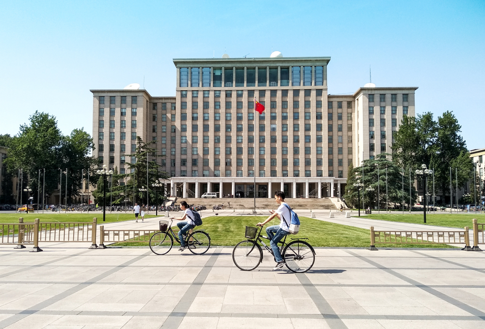 Beijing,,China-,June,1,2018:,Students,Biking,In,Front,Of