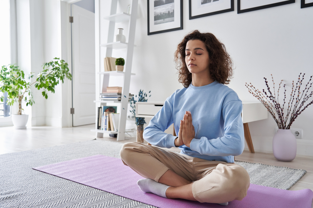 Healthy,Serene,Young,Woman,Meditating,At,Home,With,Eyes,Closed