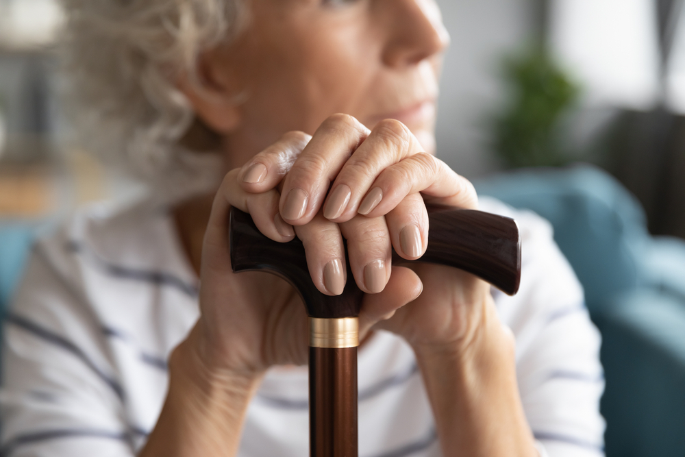 Close,Up,Focus,On,Wrinkled,Female,Hands,Lying,On,Walking